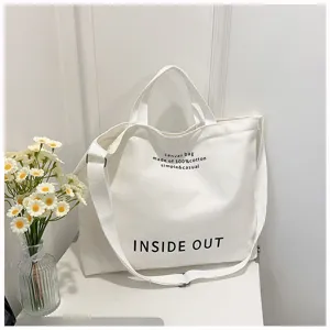 White canvas tote bag with shoulder strap, large capacity casual handbag for women daily use.