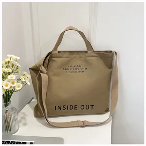Casual canvas tote bag with cotton material, large capacity and adjustable shoulder strap.