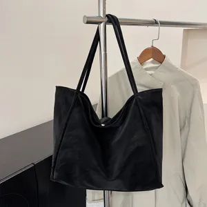 Black PU leather tote bag large capacity casual vintage shoulder bag for women commuting.