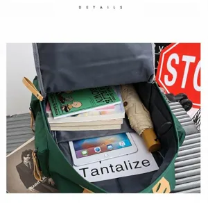 Detailed interior view of large capacity canvas backpack showing multiple storage compartments.