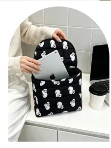Quilted tablet inner bag detail, black fabric with cute white cat print, neat storage design.