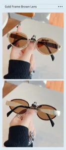 Stilvolle ovale Metallsonnenbrille für Damen und Herren mit funkelnden Strasssteinen.