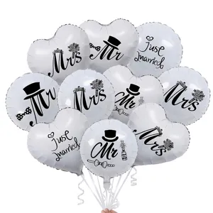 Wedding foil balloons detail showing round and heart shapes with mr mrs printed designs.