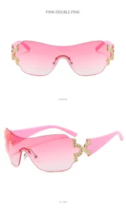 Y2K gradient pink shield sunglasses featuring luxury rhinestone gold metal hardware accents.
