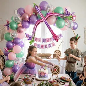Detailed party scene setup showing colorful balloon arch, birthday banner, and themed props.