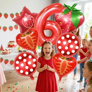 Strawberry birthday foil balloons set with number six and cute party decorations for kids.