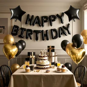 Happy Birthday balloon set with black letter foil balloons and golden party decorations.