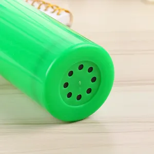 Portable green plastic balloon hand pump, manual push-pull inflator tool for parties.