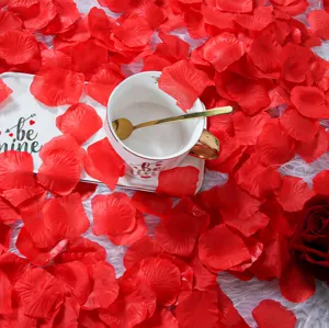 Romantic red artificial rose petals detail shot, perfect for Valentine's Day party and wedding decor.