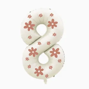 Number 8 foil balloon with pink flower print for birthday party and photo decoration detail.