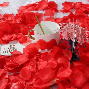 Red artificial rose petals for Valentine's day wedding party decoration and romantic table scatter.