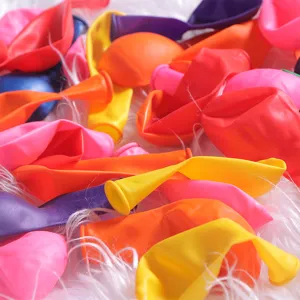 Colorful latex water balloons detail shot, assorted vibrant colors for kids summer party games.