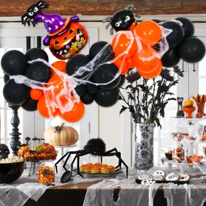 Halloween balloon arch kit with black orange balloons and pumpkin foil decorations.