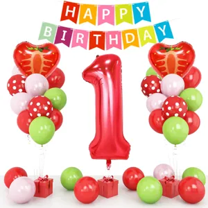 1st birthday party balloon decoration set with giant number one and strawberry foil balloons.