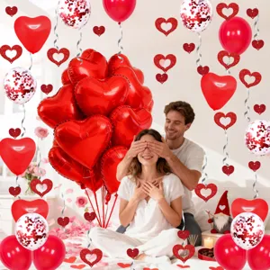 Red heart balloons and hanging decorations set for Valentine's Day party and wedding proposal decor.