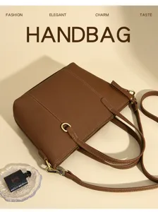 Brown leather women handbag detail shot, elegant shoulder and crossbody bag with metal hardware.