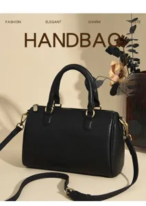 Classic black leather handbag for women, versatile shoulder and crossbody bag with strap.