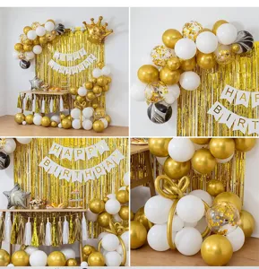 Gold white birthday party balloon decoration set with fringe curtain and happy birthday banner.