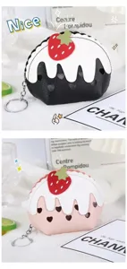 Close-up detail view of the cute strawberry cake shaped mini coin purse with keychain and zipper.
