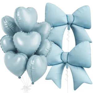 Light blue heart and bow foil balloon detail, perfect for birthday party decorations.