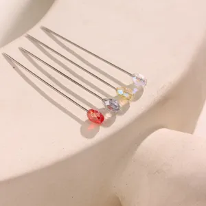 Detail view of colorful crystal hijab pins featuring sparkling multi-cut stones.