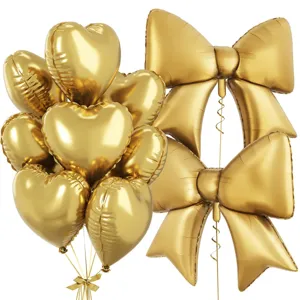 Gold heart and bow foil balloon set for birthday party decorations and celebrations.