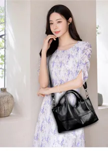 Detailed view of black soft leather handbag with large capacity for daily casual work commuting.