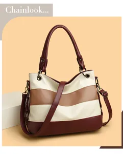 Detailed view of the chic color-block leather shoulder bag with stylish striped design and straps.