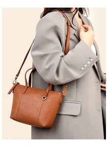 Classic brown women PU leather shoulder crossbody bag with elegant handle and strap detail.