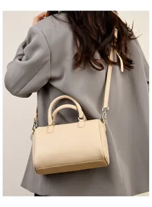 Womens beige shoulder bag, stylish PU leather Boston crossbody bag with top handles.