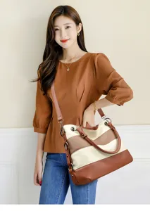 Detailed view of the color-blocked women tote bag showing texture and stylish design.