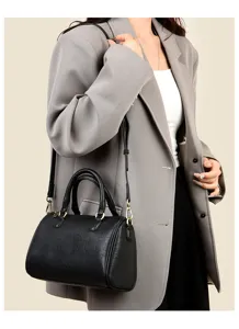Classic black women handbag, versatile minimalist shoulder bag with top handle and strap.