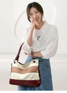Color-block striped tote bag detail, featuring multi-color leather design for daily commute.