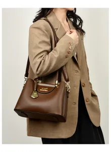 Elegant brown leather tote bag for women, stylish shoulder handbag with top handle.