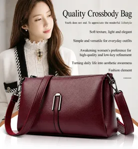 Detail view of wine red PU leather crossbody bag, soft texture and chic metal buckle.