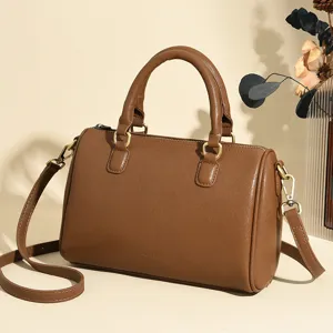 Stylish brown leather women handbag, classic top handle shoulder and crossbody bag.