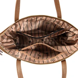 Brown women handbag top-handle shoulder bag interior detail view with lining and zipper pockets