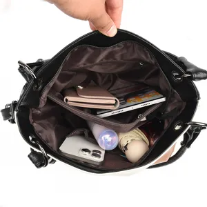 Large capacity women tote bag with multi-compartment interior for daily commuting and office use.
