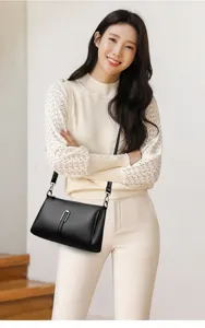 Detailed view of women's soft leather crossbody bag, elegant black shoulder bag for commute.