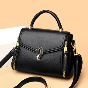 Elegant black leather handbag for women, versatile top handle shoulder crossbody bag.