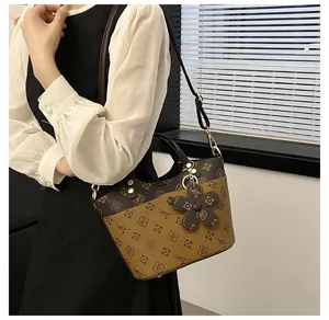 Classic vintage bucket bag for women, stylish shoulder crossbody bag with elegant floral charm.