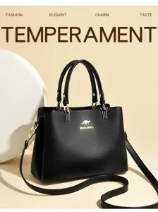 Detail view of black leather handbag featuring gold hardware and elegant texture display.