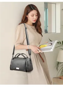 Stylish grey leather handbag for women, versatile crossbody shoulder bag for daily outfit use.