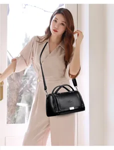 Stylish black leather handbag for women, versatile shoulder and crossbody bag with large capacity.