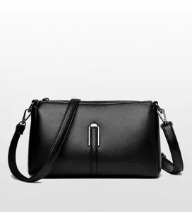 Black leather crossbody bag detail, soft PU material, minimalist shoulder bag style.