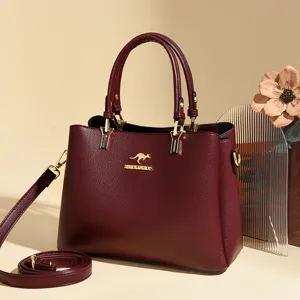 Burgundy leather tote bag for women, stylish top-handle shoulder and crossbody bag.