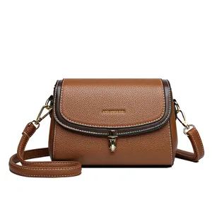 Braune Damen Umhängetasche aus Leder mit Metallverschluss und Gurt, stilvoll und lässig.