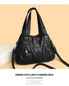 Stylish black leather tote bag for women featuring dual handles and adjustable crossbody strap.