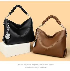 Detailed view of women fashion shoulder handbag with scrunchie handle and cute smiley charm.