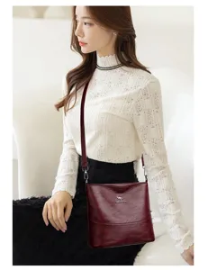 Detailed view of women's vintage soft leather crossbody bag, commuter large capacity.